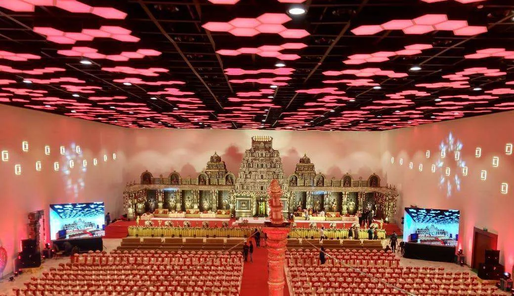 Wedding venue styled with a traditional stage and coordinated lighting
